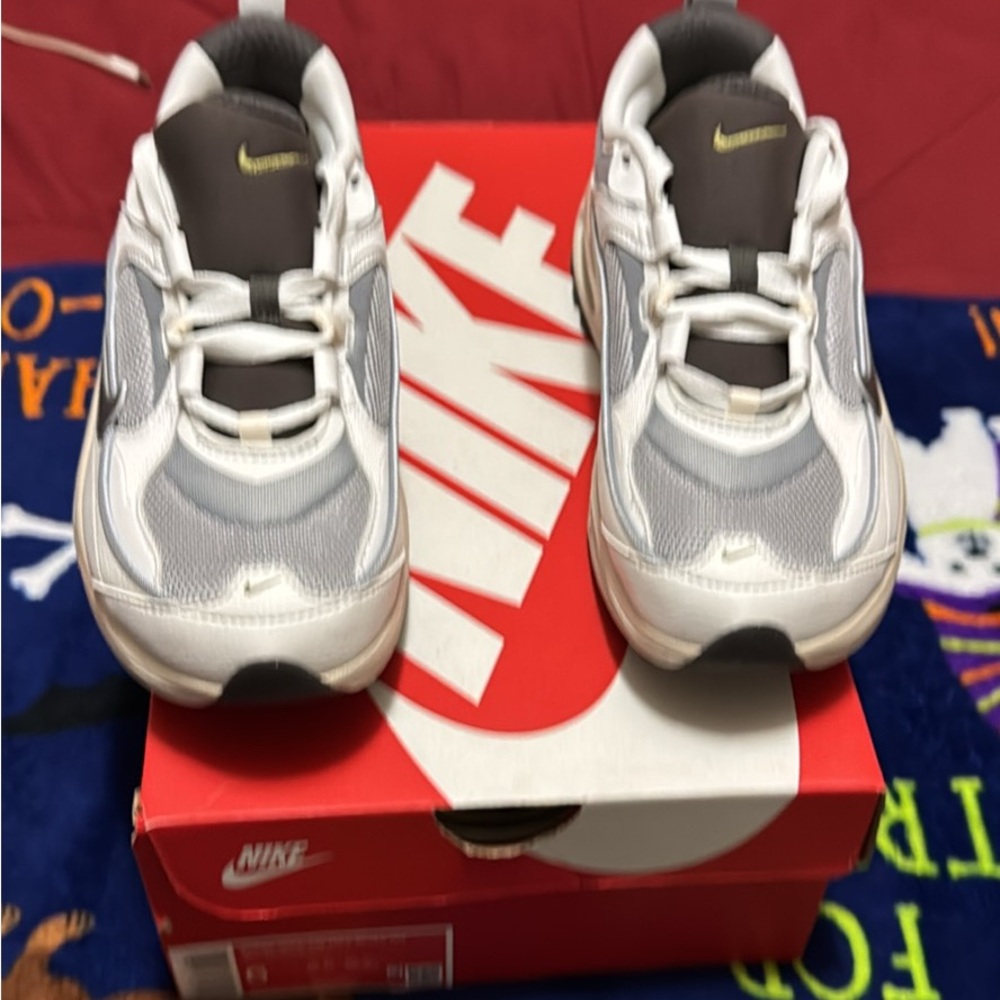 Nike women’s White and Gray Sneakers with Yellow Swoosh